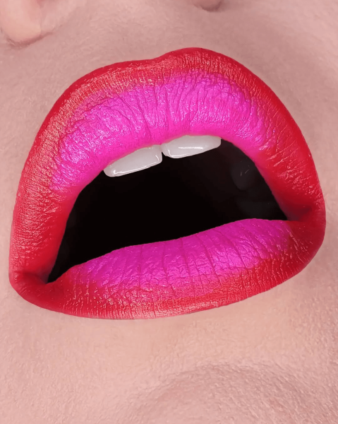 Closeup of a bright pink redlined fantasy lip combo.